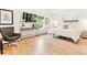 Bright bedroom boasts a sleek console table, plush chair, and a large window at 428 N Humboldt St, Denver, CO 80218