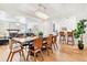 Open dining and living area with a view of the kitchen and a decorative fireplace at 428 N Humboldt St, Denver, CO 80218