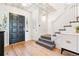 Bright entryway featuring patterned ceiling and a staircase with patterned carpet at 428 N Humboldt St, Denver, CO 80218