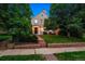 Attractive home exterior featuring a well-manicured lawn and inviting entryway at 428 N Humboldt St, Denver, CO 80218