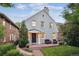 Charming two-story home with brick walkway and inviting front porch seating area at 428 N Humboldt St, Denver, CO 80218