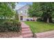 Charming home with a brick walkway leading to the front door and well-maintained lawn at 428 N Humboldt St, Denver, CO 80218