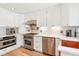 Bright kitchen with stainless steel appliances, white cabinets and subway tile backsplash at 428 N Humboldt St, Denver, CO 80218