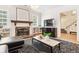 Stylish living room featuring hardwood floors, fireplace, and a large window at 428 N Humboldt St, Denver, CO 80218