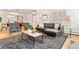 Stylish living room featuring hardwood floors, fireplace, and a large window at 428 N Humboldt St, Denver, CO 80218