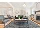 Stylish living room featuring hardwood floors, fireplace, and a large window at 428 N Humboldt St, Denver, CO 80218