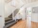 Bright staircase features patterned ceiling and a staircase with patterned carpet at 428 N Humboldt St, Denver, CO 80218