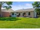 Backyard with manicured grass, patio, seating, and a grill, great for outdoor living at 9236 Vrain Ct, Westminster, CO 80031