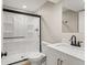 Bathroom featuring a step-in shower with glass doors, a toilet, and vanity at 9236 Vrain Ct, Westminster, CO 80031