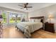 Inviting bedroom with a large bay window offering a view of the backyard and comfortable furnishings at 9236 Vrain Ct, Westminster, CO 80031