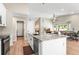 Bright kitchen featuring white cabinetry, granite countertops and an open floor plan at 9236 Vrain Ct, Westminster, CO 80031