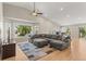 Spacious living room featuring a large sectional sofa and a ceiling fan at 9236 Vrain Ct, Westminster, CO 80031