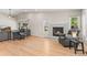 Spacious living room featuring a fireplace, hardwood floors, and plenty of natural light at 9236 Vrain Ct, Westminster, CO 80031