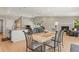 Open-concept living and dining area with hardwood floors at 9236 Vrain Ct, Westminster, CO 80031