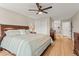 Serene main bedroom with a king bed, a ceiling fan, and hardwood floors at 9236 Vrain Ct, Westminster, CO 80031