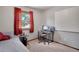Bedroom space featuring a desk, view to the exterior, and a bed at 330 Johnson Dr, Castle Rock, CO 80104