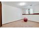 Bedroom with a tan carpet, white walls, a small window, and simple decor at 330 Johnson Dr, Castle Rock, CO 80104