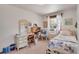 Comfortable bedroom with a vanity and ample natural light from dual windows at 330 Johnson Dr, Castle Rock, CO 80104