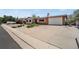 Lovely ranch-style home with large driveway, lush landscaping, and attached two-car garage, providing ample parking at 330 Johnson Dr, Castle Rock, CO 80104