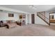 Spacious living room with cozy leather seating, warm carpet, and natural light at 330 Johnson Dr, Castle Rock, CO 80104