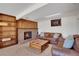 Cozy living room with a brick fireplace and comfortable leather furniture at 330 Johnson Dr, Castle Rock, CO 80104