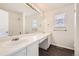 Bathroom with long vanity and mirror, plus a shower at 4105 N Dunkirk Ct, Denver, CO 80249