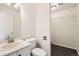 Powder room offers vanity and toilet plus storage space at 4105 N Dunkirk Ct, Denver, CO 80249