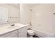 This well-lit bathroom features a shower and bath tub combination at 4105 N Dunkirk Ct, Denver, CO 80249