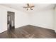Bedroom features neutral paint, hardwood floors, and ceiling fan at 4105 N Dunkirk Ct, Denver, CO 80249