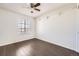 Bedroom features hardwood floors, a ceiling fan, and closet space at 4105 N Dunkirk Ct, Denver, CO 80249