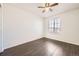 Bedroom with hardwood floors, ceiling fan and a bright window at 4105 N Dunkirk Ct, Denver, CO 80249