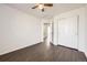 This cozy bedroom features hard wood floors, neutral paint, and a ceiling fan at 4105 N Dunkirk Ct, Denver, CO 80249