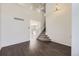 Bright living room boasts hardwood floors, high ceilings, and a staircase to the second floor at 4105 N Dunkirk Ct, Denver, CO 80249