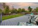 Inviting backyard deck with lounge seating overlooking a well-manicured lawn and mature landscaping at 6013 S Logan St, Centennial, CO 80121