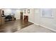 Finished basement with vinyl flooring and a carpeted section, plus a built-in desk at 6013 S Logan St, Centennial, CO 80121
