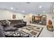 Finished basement with entertainment center, neutral colored walls and plush carpeting at 6013 S Logan St, Centennial, CO 80121