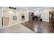 Finished basement with vinyl flooring, built-in desk, tile counter, and a mini fridge at 6013 S Logan St, Centennial, CO 80121