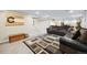 Relaxing finished basement area featuring a comfortable sectional sofa and stylish rug at 6013 S Logan St, Centennial, CO 80121