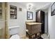 Bathroom featuring modern vanity with granite counters and decorative Brooklyn art at 6013 S Logan St, Centennial, CO 80121