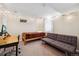 Finished basement bedroom area with a twin bed, futon, and desk with carpeted floors at 6013 S Logan St, Centennial, CO 80121