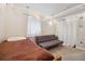 Finished basement bedroom area with a twin bed, futon, and carpeted floors at 6013 S Logan St, Centennial, CO 80121