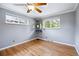 Spare bedroom with wood floors and a large bright window at 6013 S Logan St, Centennial, CO 80121