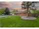 Lovely single-Gathering home with lush front yard and mature tree providing shade and curb appeal at 6013 S Logan St, Centennial, CO 80121