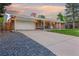 Charming brick home with a covered porch and a spacious driveway, perfect for Gathering living at 6013 S Logan St, Centennial, CO 80121