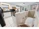 Bright kitchen leading to downstairs, featuring white cabinets and granite countertops at 6013 S Logan St, Centennial, CO 80121