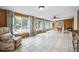 Bright sunroom with tile floors, a ceiling fan, and lots of natural light at 6013 S Logan St, Centennial, CO 80121