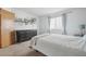 Calm bedroom featuring a dresser, neutral walls, and a window with a view at 4314 Nepal St, Denver, CO 80249