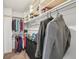 Organized walk-in closet with shelving, hanging space, and storage for clothes and accessories at 4314 Nepal St, Denver, CO 80249