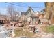 Spacious backyard with unique water features and gray house in background at 3328 Bryant St, Denver, CO 80211