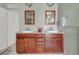 Elegant bathroom featuring a double sink vanity with framed mirrors, combining classic style and functionality at 3328 Bryant St, Denver, CO 80211